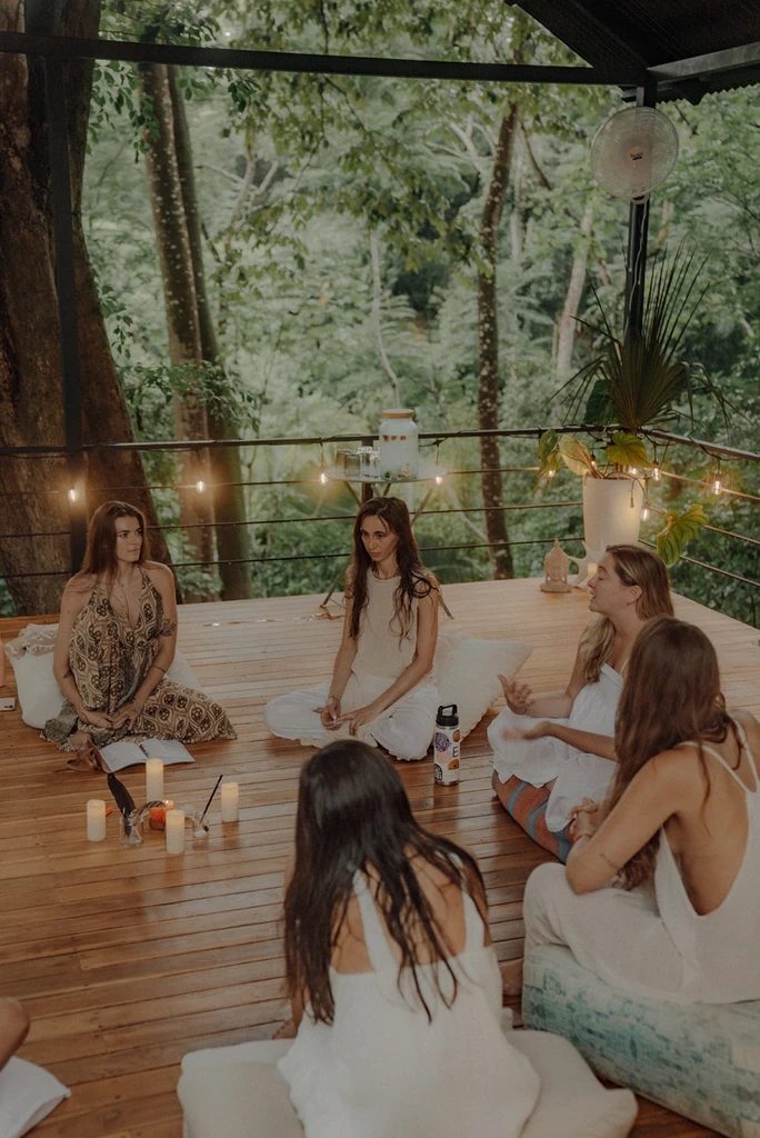 Retreat guests sharing a circle indoors